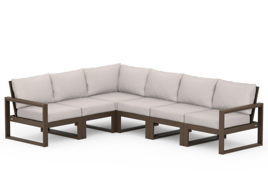 Sectional outdoor sofa with beige cushions on a white background