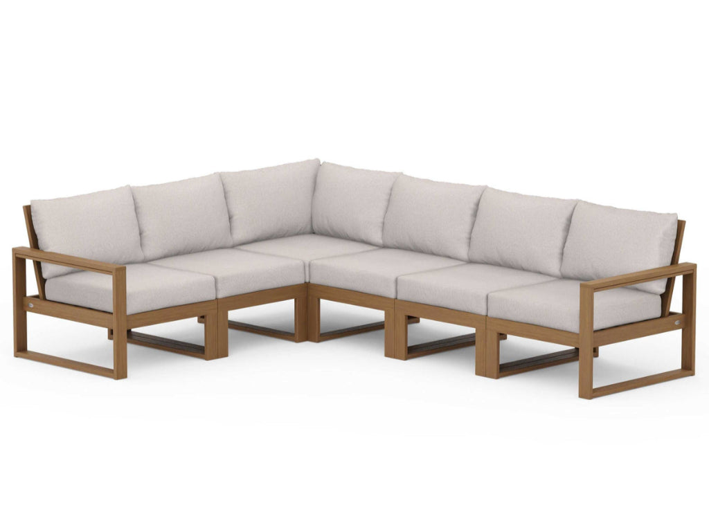 Sectional outdoor sofa with beige cushions on a white background